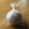 8. Packaged for Posting: knotted plastic bag with label